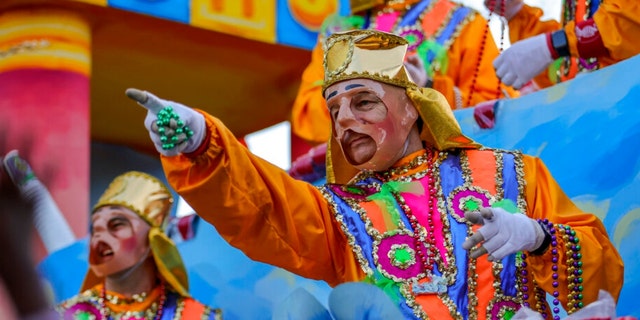 The Krewe of Proteus rolls on the Uptown route with the theme "Divine Tricksters" in New Orleans on Monday, Feb. 28, 2022.
