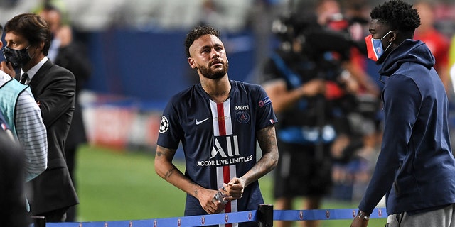 PSG's Neymar stands disappointed after losing the Champions League final soccer match between Paris Saint-Germain and Bayern Munich at the Luz stadium in Lisbon, Portugal, Aug. 23, 2020.