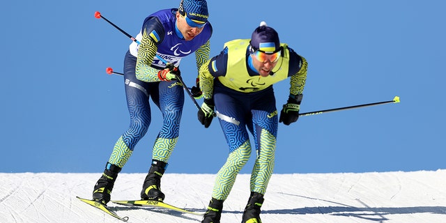 Oleksandr Kazik of Team Ukraine and his guide Serhii Kucheruavyi compete in the Men's Sprint Vision Impaired Para Biathlon during Day One of the Beijing 2022 Winter Paralympics at Zhangjiakou National Biathlon Centre on March 05, 2022 in Beijing, China.