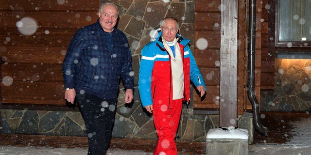 Russian President Vladimir Putin, right, and Belarusian President Alexander Lukashenko walk during their meeting at the Black Sea resort of Sochi, Russia, Monday, Feb. 22, 2021. 