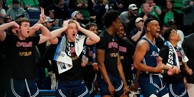 Richmond's Nick Sherod (5) celebrates with teammates in the second half of a college basketball game against the Iowa during the first round of the NCAA men's tournament Thursday, March 17, 2022, in Buffalo, N.Y.