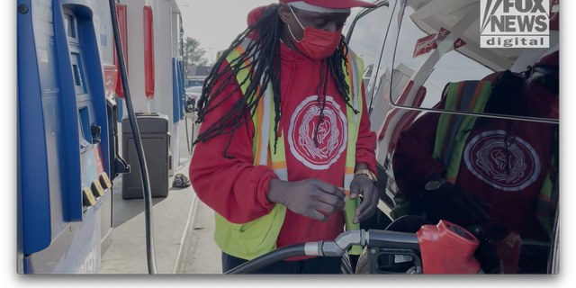 William, a driver for a ride-hailing service, fuels his vehicle before work. 