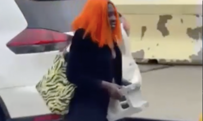 Brazen thief in orange wig bashes NYC taxi with cinder block: video
