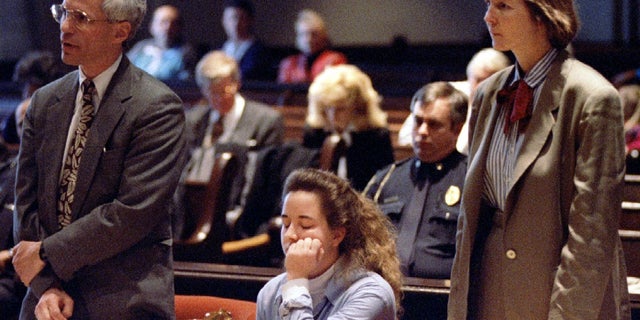 Susan Smith is seated between her lawyers during a court hearing in the Union County Courthouse.