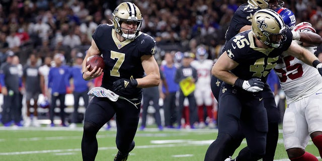 New Orleans Saints quarterback Taysom Hill (7) carries in the first half of an NFL football game against the New York Giants in New Orleans, Sunday, Oct. 3, 2021.