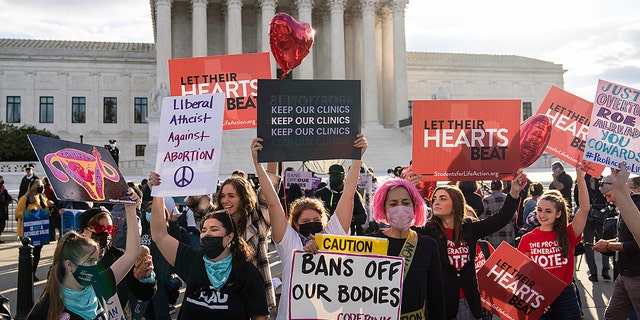 Abortion-rights and anti-abortion demonstrators rally outside the U.S. Supreme Court Nov. 1, 2021, in Washington. 