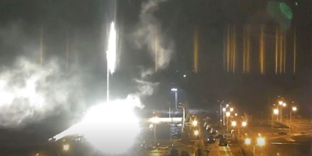 This image made from a video released by Zaporizhzhia nuclear power plant shows bright flaring object landing in grounds of the nuclear plant in Enerhodar, Ukraine Friday, March 4, 2022. 