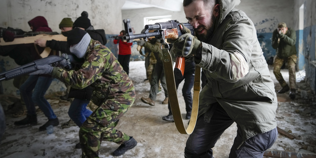 Local residents train close to Kyiv, Ukraine, on Sunday.