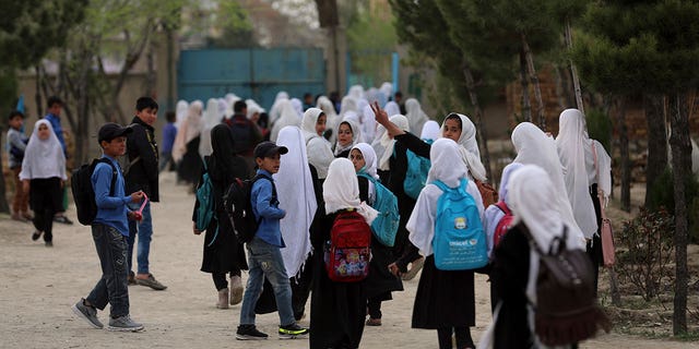 Afghan students leave school classes in a primary school in Kabul, Afghanistan on March 27, 2021. 