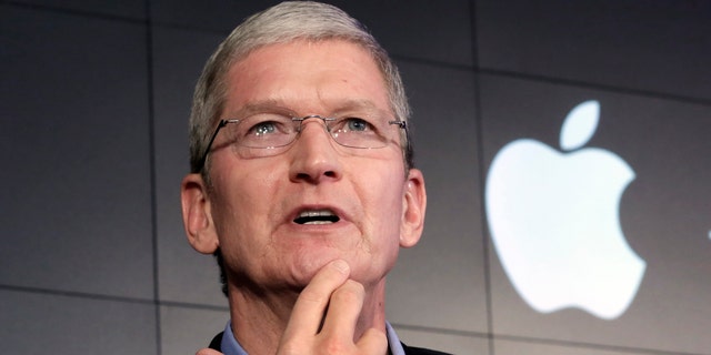 File photo - Apple CEO Tim Cook responds to a question during a news conference at IBM Watson headquarters, in New York, Thursday, April 30, 2015. 