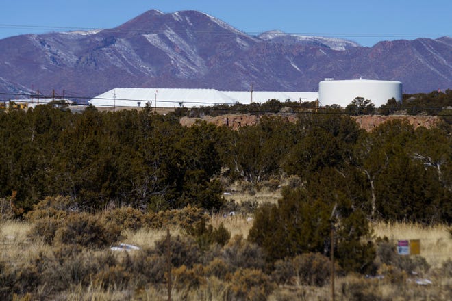 White tents can be seen on the hill near White Rock, a community near Los Alamos National Laboratory in New Mexico.