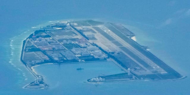 Chinese structures and buildings at the man-made island on Mischief Reef at the Spratly group of islands in the South China Sea seen Sunday, March 20, 2022. 