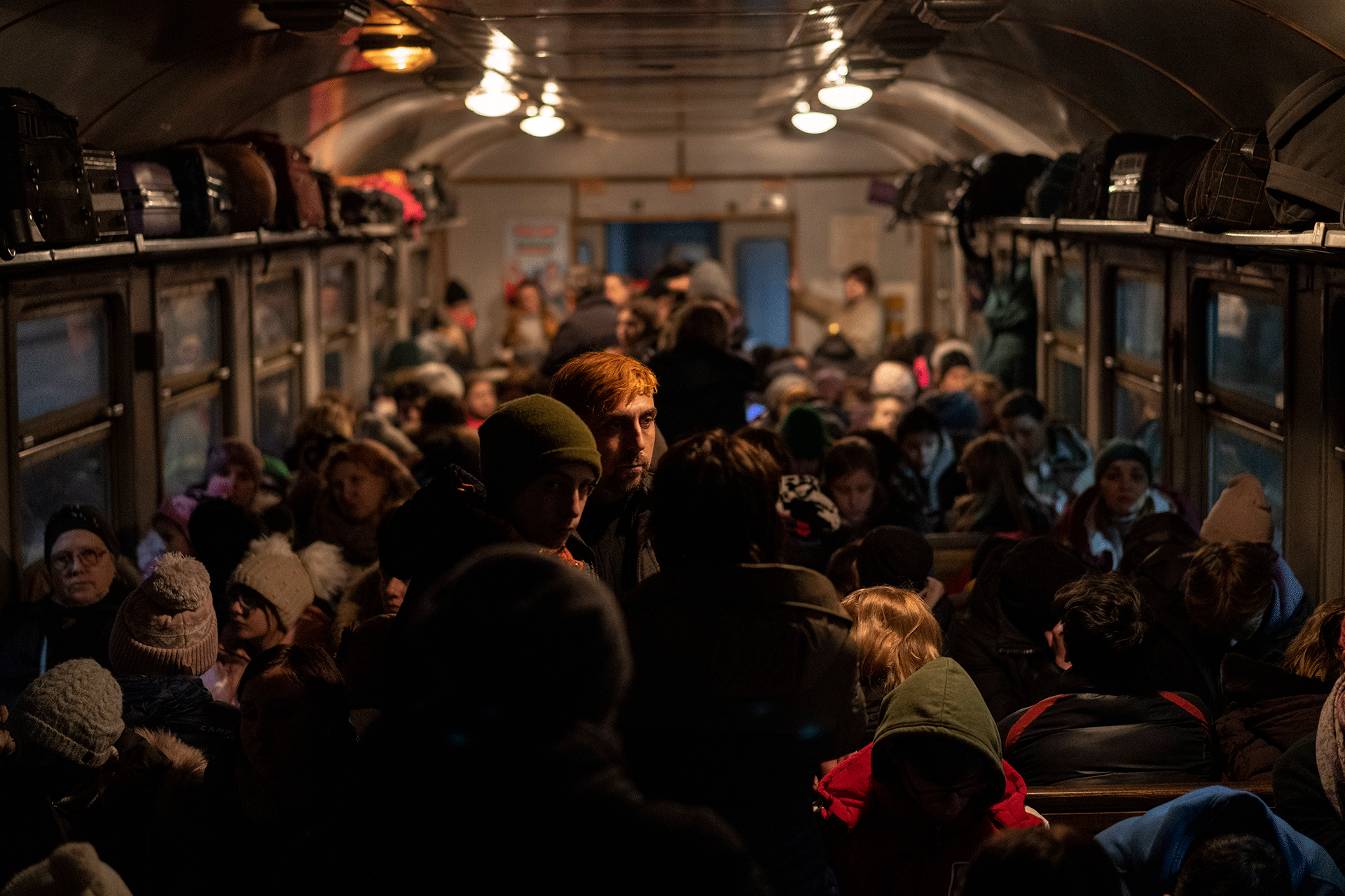 Displaced Ukrainians onboard a Poland-bound train in Lviv, western Ukraine, Sunday, March 13, 2022. 