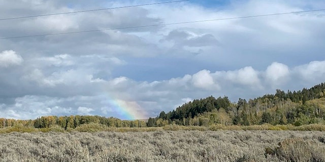 Reporters witnessed a rainbow overhead just moments after authorities removed Gabby Petito's remains from a campsite in Wyoming's Bridger-Teton National Forest.