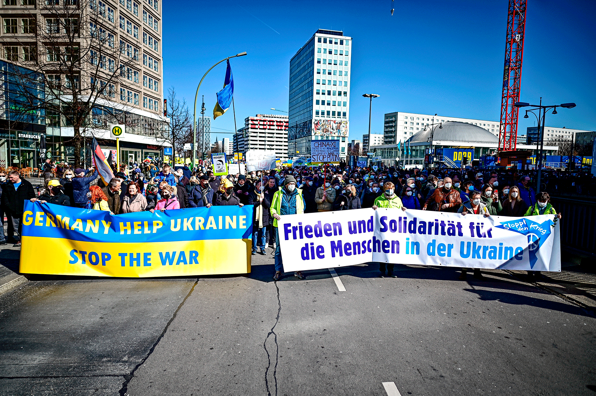People take part in the "Stop the war! Peace and solidarity for the people in Ukraine" demonstration in Berlin, Germany, Sunday, March 13, 2022.