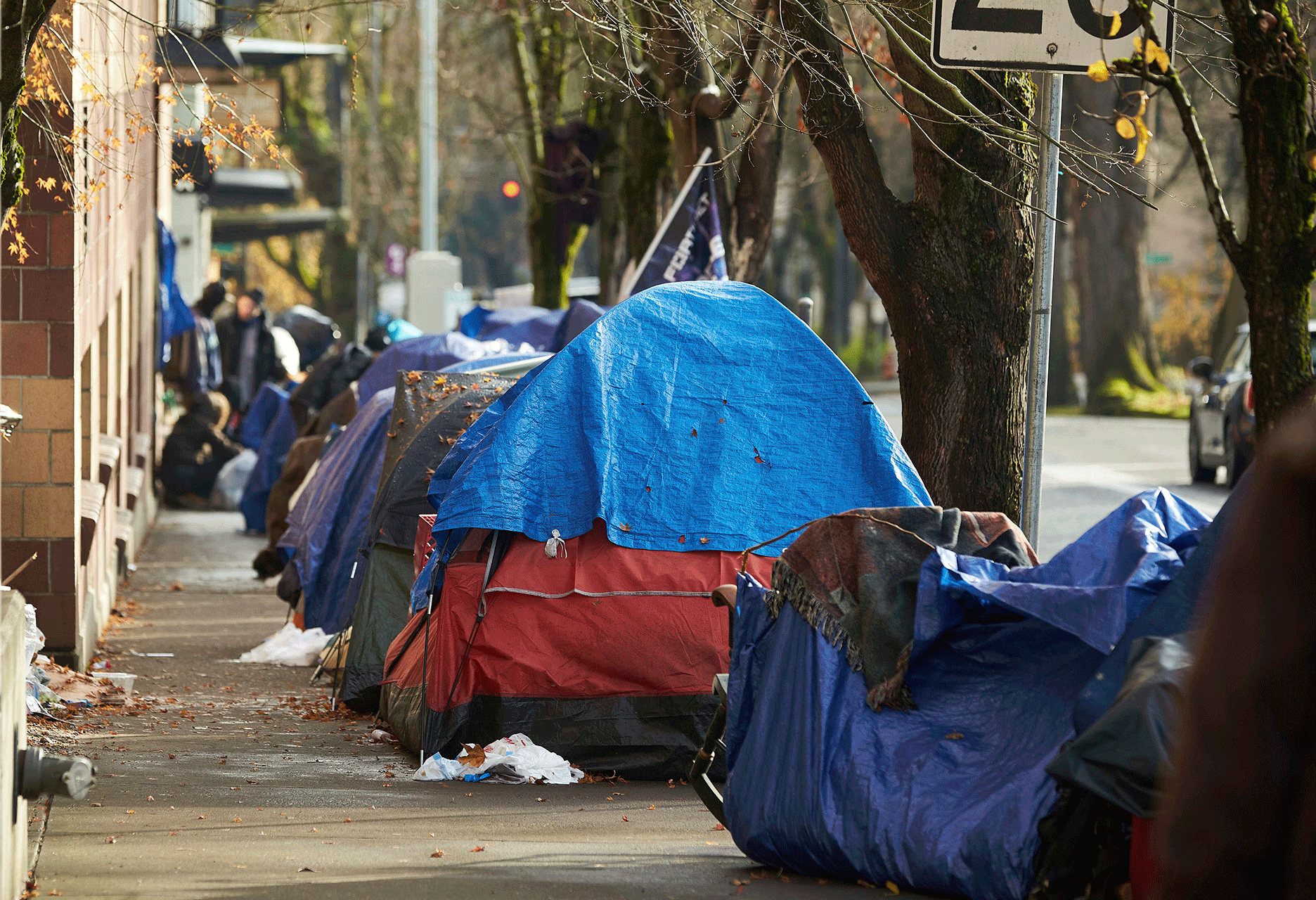 Tents line the sidewalk on SW Clay St. in downtown Portland, Ore., Dec. 9, 2020.