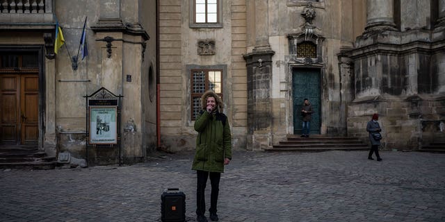 A man recites a poem on March 19, 2022, in downtown Lviv, Western Ukraine, the last outpost before Poland and host to hundreds of thousands of Ukrainians streaming through or staying on.