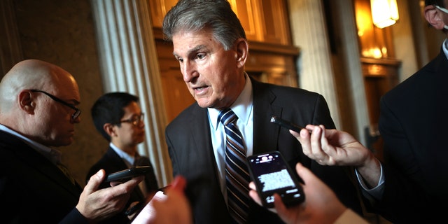 Sen. Joe Manchin (D-WV) talks with reporters after stepping off the Senate Floor at the U.S. Capitol on May 28, 2021 in Washington, DC.