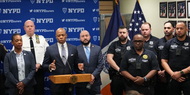 Mayor Adams flanked by members of the NYPD's new Neighborhood Safety Teams. 