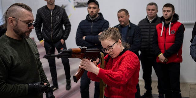 Ukrainian civilians receive weapons training in Lviv, Western Ukraine, Saturday, March 19, 2022.