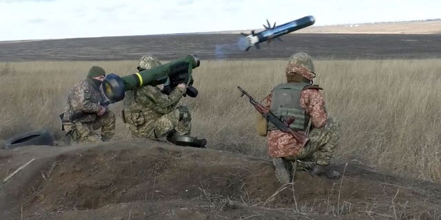 In this image taken from footage provided by the Ukrainian Defense Ministry Press Service, Ukrainian soldiers use a launcher with U.S. javelin missiles during military exercises in Donetsk region, Ukraine, Jan. 12, 2022. 