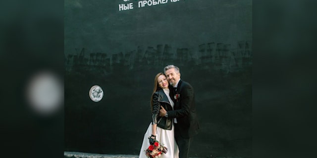 The couple poses after getting married