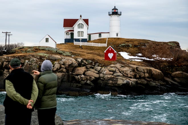 John and Jan Ferry of Portland visit the Nubble Lighthouse in Cape Neddick, Maine, on Monday, March 1, 2021.