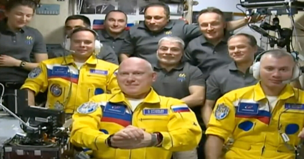 Russians’ yellow-and-blue flight suits weren’t a political statement, a NASA astronaut says.