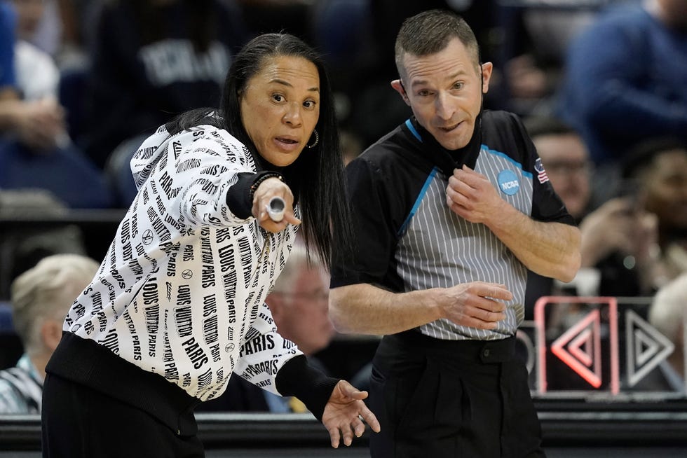 South Carolina head coach Dawn Staley speaks with an official during the first half of a college basketball game against Creighton in the Elite 8 round of the NCAA tournament in Greensboro, N.C., Sunday, March 27, 2022. (AP Photo/Gerry Broome)
