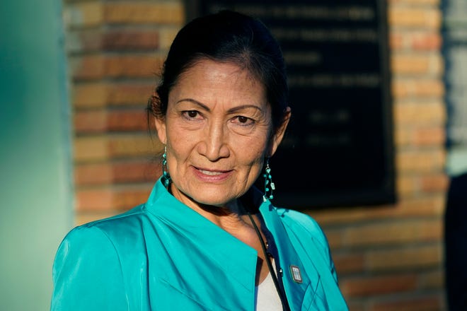 FILE - Secretary of the Interior Deb Haaland speaks with reporters while standing outside the Medgar and Myrlie Evers Home National Monument in Jackson, Miss., on Feb. 15, 2022. The Interior Department is on the verge of releasing a report on its investigation into the federal government's past oversight of Native American boarding schools. Interior Secretary Deb Haaland said Wednesday, March 16, 2022, the report will come out next month. (AP Photo/Rogelio V. Solis, File)