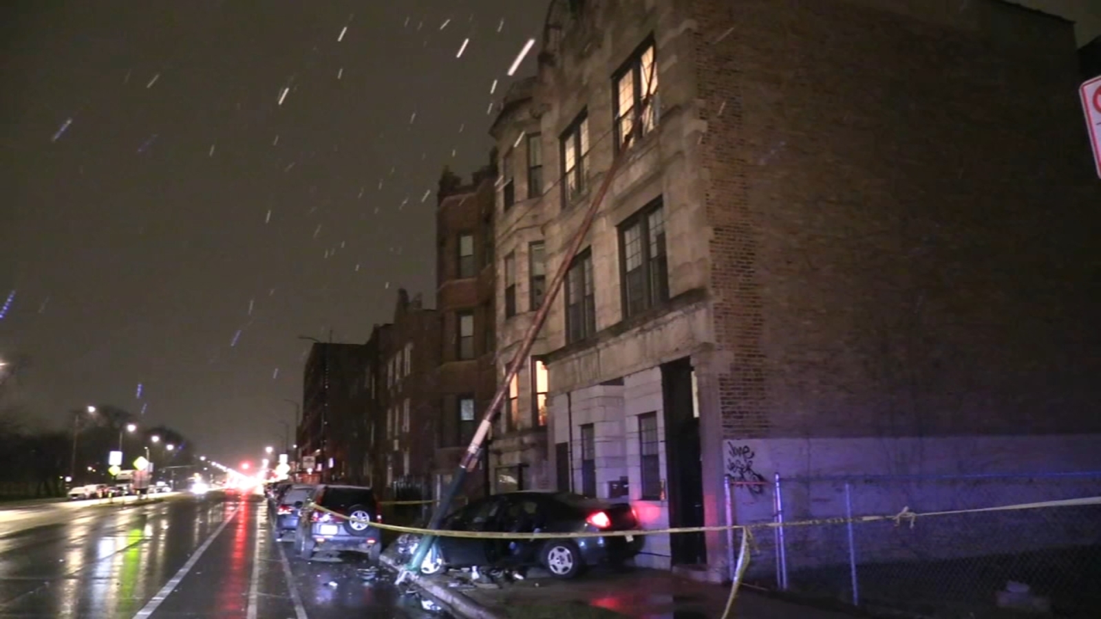 Car crash leads to light pole falling into West Town building, damaging 3rd story window