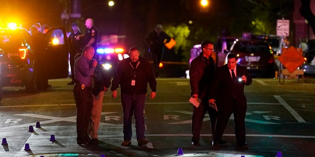 Authorities search area of the scene of a mass shooting with multiple deaths in Sacramento, Calif. Sunday, April 3, 2022.