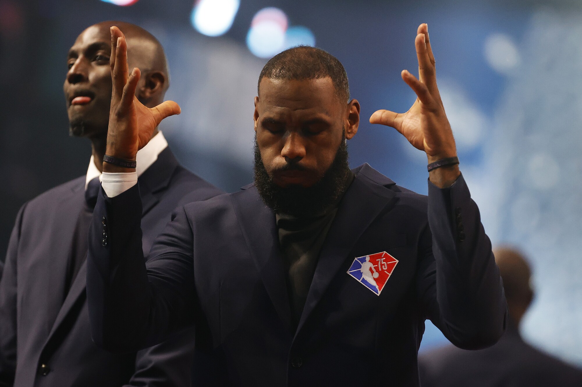 LeBron James reacts after being introduced as part of the NBA 75th Anniversary Team.