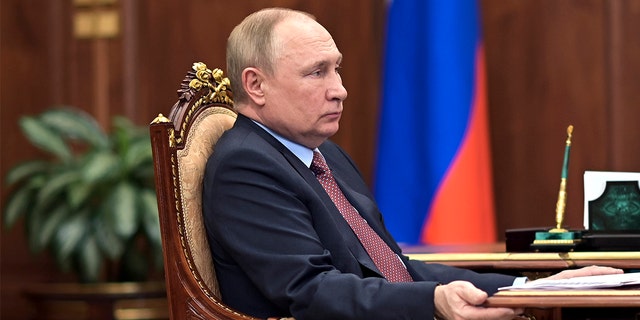 Russian President Vladimir Putin attends a meeting in the Kremlin in Moscow, Russia, Wednesday, April 6, 2022. 