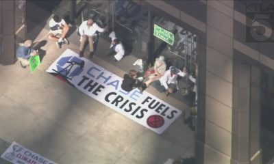 Climate activists handcuff themselves to bank building in downtown L.A.