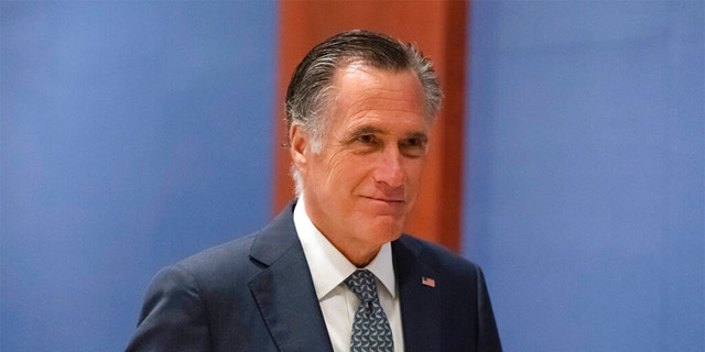 Sen. Mitt Romney, R-Utah, arrives to watch a speech by Ukrainian President Volodymyr Zelenskyy live-streamed into the U.S. Capitol, in Washington, March 16, 2022.