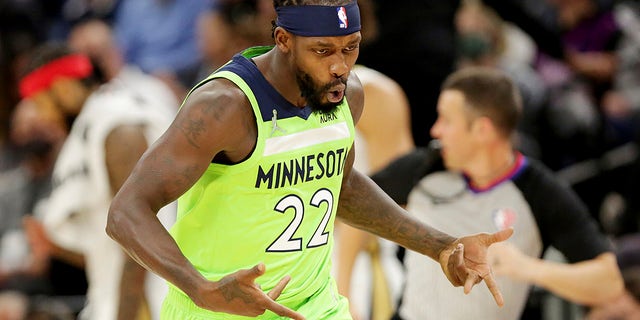 Minnesota Timberwolves guard Patrick Beverley (22) celebrates a basket against the New Orleans Pelicans in the first half of an NBA basketball game, Saturday, Oct. 23, 2021, in Minneapolis.