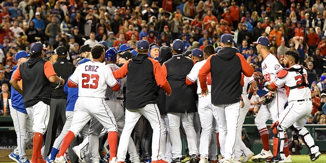 The benches clear after Steve Cishek (33) of the Washington Nationals hits Francisco Lindor (12) of the New York Mets with a pitch in the fifth inning of a game at Nationals Park April 8, 2022, in Washington, D.C.