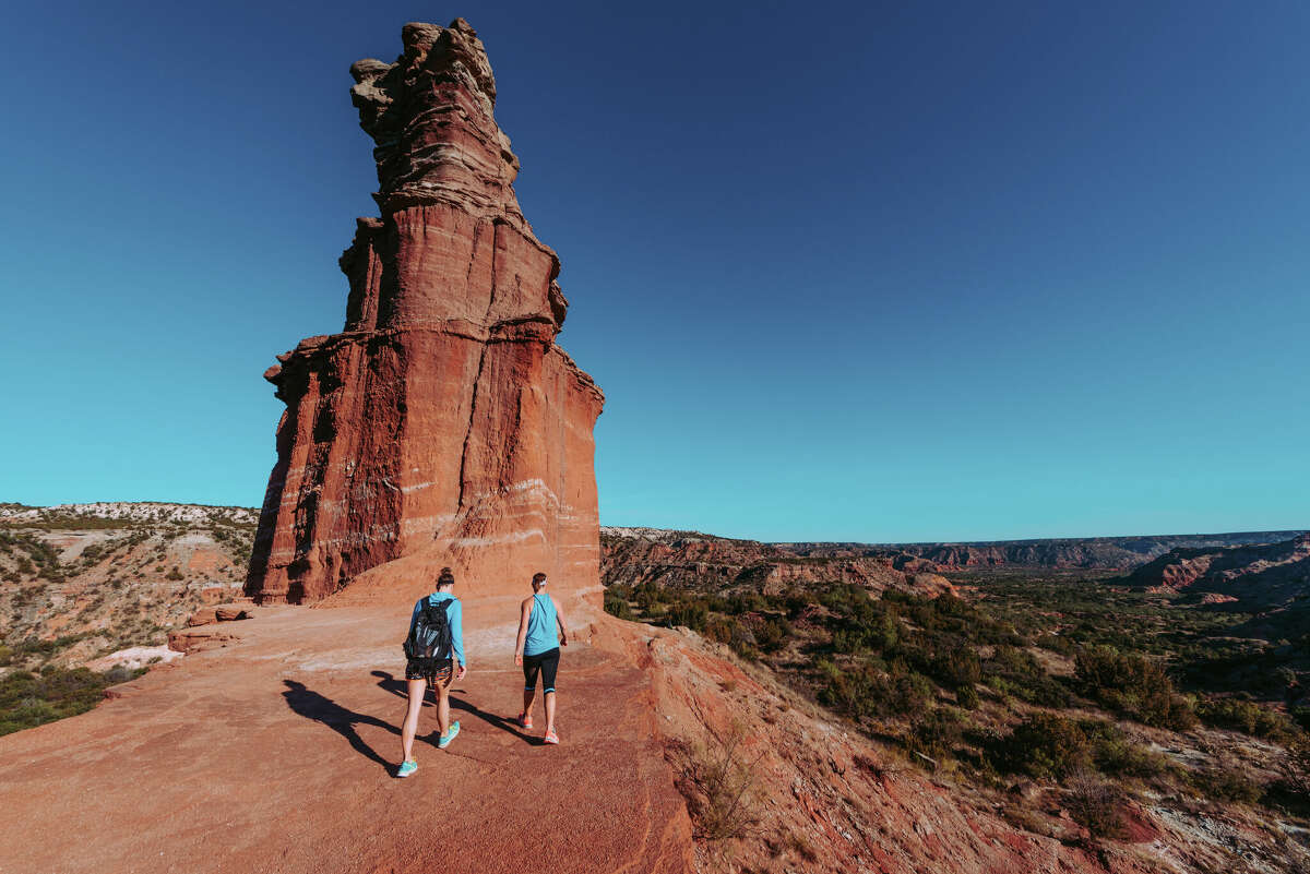 Hikers at the Lighthouse rock formation in the Palo Duro Canyon State Park in Canton, Texas. (Steve Johnson via Getty Images)