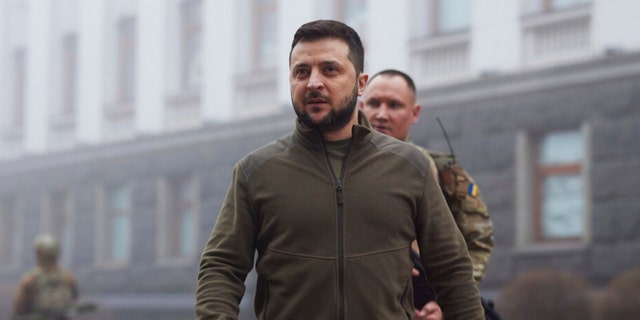 In this photo provided by the Ukrainian Presidential Press Office, Ukrainian President Volodymyr Zelenskyy, center, walks before a meeting with President of the European Parliament Roberta Metsola in Kyiv, Ukraine, Friday, April 1, 2022. 