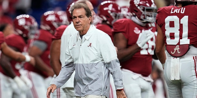 FILE - Alabama coach Nick Saban watches players warm up for the College Football Playoff championship NCAA football game against Georgia on  Jan. 10, 2022, in Indianapolis.