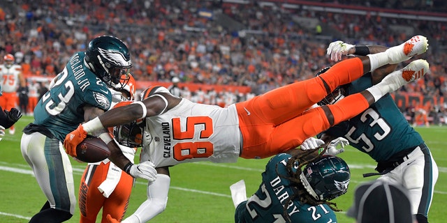 Cleveland Browns tight end David Njoku (85) is up-ended during the first half of an NFL preseason football game against the Philadelphia Eagles, Thursday, Aug. 23, 2018, in Cleveland.