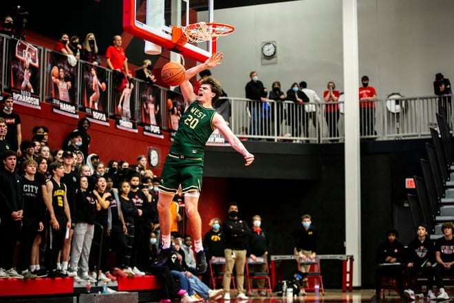 Iowa City West's Pete Moe dunks the ball during a Class 4A varsity boys' basketball game against Iowa City High, Friday, Dec. 17, 2021, at City High Arena in Iowa City, Iowa.