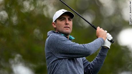 Scheffler watches his tee shot on the fourth tee during the third round at the Masters.