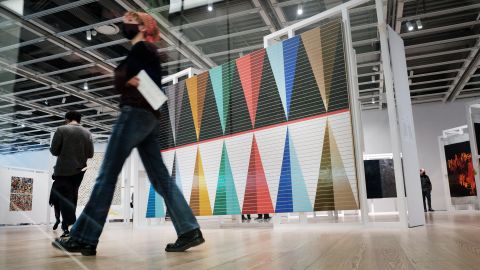 People walk through the Whitney Biennial show at the Whitney Museum of Art on April 06, 2022 in New York City. 