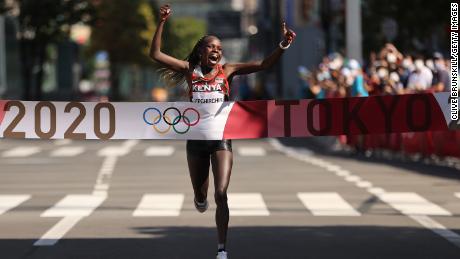 Kenya&#39;s Peres Jepchirchir celebrates as she crosses the finish line to win the gold medal in the Women&#39;s Marathon Final at the Tokyo 2020 Olympics on August 7, 2021 in Japan.