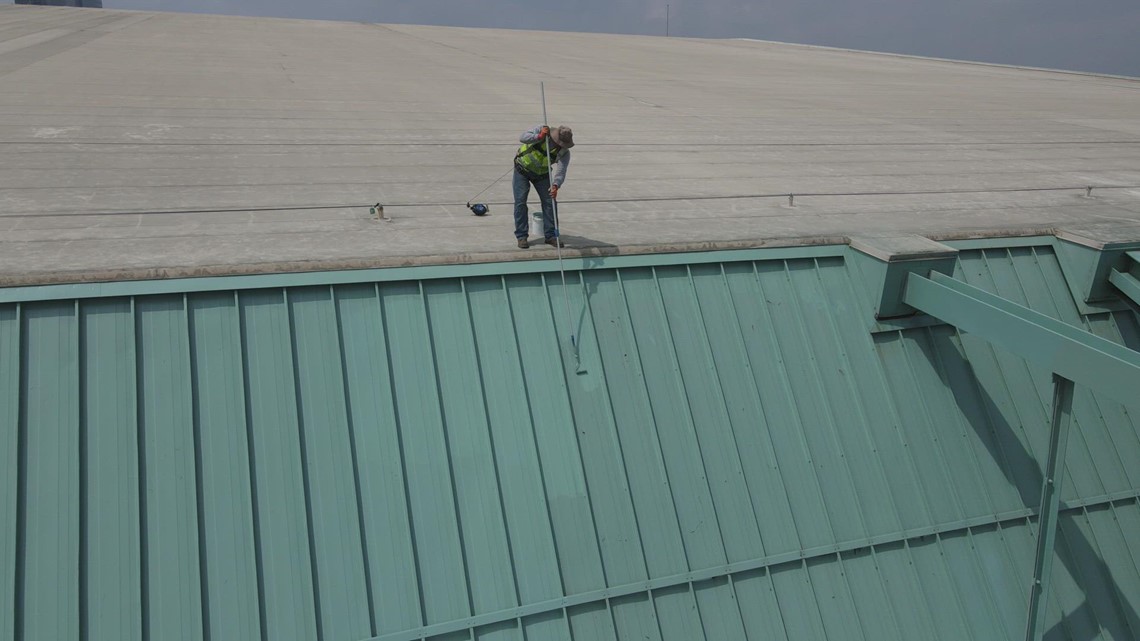 Drone video: Painter helps prep roof at Minute Maid Park for Astros Opening Day