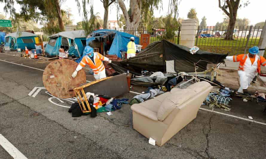 Members of the clean-up crew dismantled tents on the Veterans Row in an effort to help homeless veterans move onto the West Los Angeles Veterans Affairs campus.