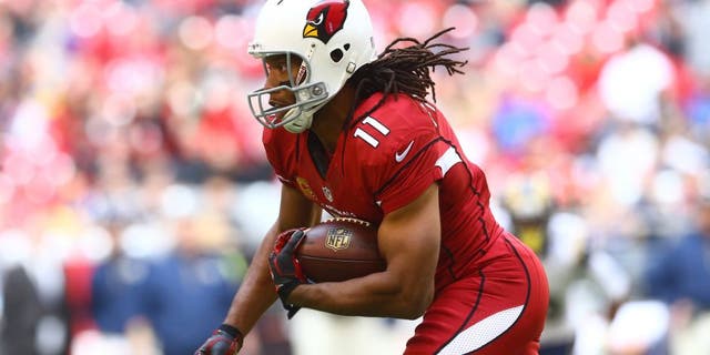 Arizona Cardinals wide receiver Larry Fitzgerald (11) runs the ball in the first quarter against the St. Louis Rams at University of Phoenix Stadium on Dec 8, 2013. 