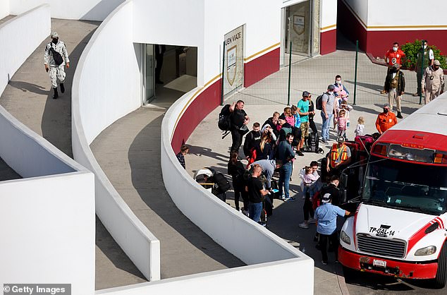 Ukrainian migrants seeking asylum are pictured in Mexico on April 6. Abbott says anyone crossing into Texas illegally will now be deposited on the steps of the US Capitol building